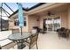 Relaxing patio with seating area and lake view at 288 Fairway Isles Ln, Bradenton, FL 34212