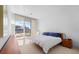 Bright bedroom with water views and wooden furniture at 3030 Grand Bay Blvd # 396, Longboat Key, FL 34228