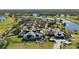 Aerial view of the clubhouse, showcasing its design and surrounding landscape at 3178 Dick Wilson Dr, Sarasota, FL 34240