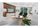 Bright and airy living room with modern furniture and a feature wall at 3178 Dick Wilson Dr, Sarasota, FL 34240