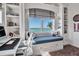 Bright bedroom with window seat and water views at 3500 Bayou Louise Ln, Sarasota, FL 34242