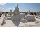 Intricate sand sculpture of a sleeping giant, showcasing architectural details and artistic craftsmanship at 3500 Bayou Louise Ln, Sarasota, FL 34242