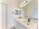 Double vanity bathroom with a large mirror and updated fixtures at 3524 Walker Is, Bradenton, FL 34208