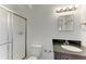 Bathroom with dark vanity and a walk-in shower at 3524 Walker Is, Bradenton, FL 34208