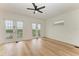 Bright bedroom with hardwood floors and access to a private balcony at 3524 Walker Is, Bradenton, FL 34208