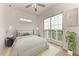 Bedroom with sliding glass doors leading to a balcony and water views at 3524 Walker Is, Bradenton, FL 34208