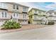 Three-story townhouses with attached garages and landscaped yards at 3524 Walker Is, Bradenton, FL 34208
