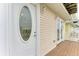White door with oval stained glass window at 3524 Walker Is, Bradenton, FL 34208