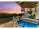 Relaxing hot tub on deck with spiral staircase and sunset view at 3524 Walker Is, Bradenton, FL 34208