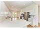 Modern kitchen with white cabinets, stainless steel appliances, and marble countertops at 3524 Walker Is, Bradenton, FL 34208
