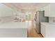 Modern kitchen with white cabinets, stainless steel appliances, and marble countertops at 3524 Walker Is, Bradenton, FL 34208