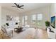 Light-filled living room with hardwood floors and access to a balcony at 3524 Walker Is, Bradenton, FL 34208