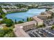 Waterfront community with apartment buildings, parking, and a lake visible in this aerial shot at 3544 Lake Bayshore Dr # K123, Bradenton, FL 34205