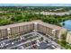 Apartment building with parking and a view of the surrounding area from an aerial view at 3544 Lake Bayshore Dr # K123, Bradenton, FL 34205