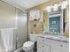 Clean bathroom, featuring a shower, toilet and vanity with marble top at 3544 Lake Bayshore Dr # K123, Bradenton, FL 34205