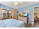 Main bedroom features a king-size bed and private balcony access at 3544 Lake Bayshore Dr # K123, Bradenton, FL 34205