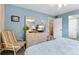 Bright bedroom with dresser, chair, and comfortable bed at 3544 Lake Bayshore Dr # K123, Bradenton, FL 34205