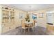 Condo dining area with table and chairs, kitchen view at 3544 Lake Bayshore Dr # K123, Bradenton, FL 34205