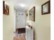 Condo entryway with mirror and small table at 3544 Lake Bayshore Dr # K123, Bradenton, FL 34205