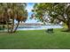 Serene lakefront view with lush landscaping at 3544 Lake Bayshore Dr # K123, Bradenton, FL 34205
