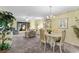 Condo living and dining area with light carpeting at 3544 Lake Bayshore Dr # K123, Bradenton, FL 34205