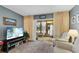 Living room with sliding glass doors leading to a screened porch at 3544 Lake Bayshore Dr # K123, Bradenton, FL 34205
