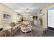 Bright living room features comfortable seating and a view into the dining area at 3544 Lake Bayshore Dr # K123, Bradenton, FL 34205