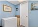 Small storage room with chest freezer and additional shelving at 3544 Lake Bayshore Dr # K123, Bradenton, FL 34205