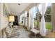 Sunroom with ample natural light and comfy seating at 3544 Lake Bayshore Dr # K123, Bradenton, FL 34205