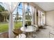 Sunroom with water view and ample natural light at 3544 Lake Bayshore Dr # K123, Bradenton, FL 34205