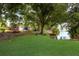 Kayaks and paddleboards are stored near a serene waterfront setting at 3544 Lake Bayshore Dr # K123, Bradenton, FL 34205