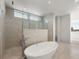 Spa-like bathroom with soaking tub and walk-in shower at 3638 San Remo Ter, Sarasota, FL 34239