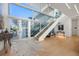Bright and spacious entryway with modern staircase and hardwood floors at 3638 San Remo Ter, Sarasota, FL 34239