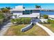 Luxury waterfront home with modern design and lush landscaping at 3638 San Remo Ter, Sarasota, FL 34239