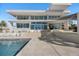 Contemporary home exterior with pool and expansive water views at 3638 San Remo Ter, Sarasota, FL 34239