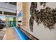 Modern fireplace with unique wall art and blue lighting at 3638 San Remo Ter, Sarasota, FL 34239