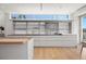 Modern kitchen featuring white cabinetry and stainless steel appliances at 3638 San Remo Ter, Sarasota, FL 34239