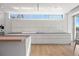 Contemporary kitchen with white cabinets and expansive windows at 3638 San Remo Ter, Sarasota, FL 34239