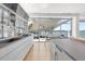 Modern kitchen with water views and sleek, white cabinetry at 3638 San Remo Ter, Sarasota, FL 34239