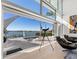 Living room with expansive water views and sliding glass doors at 3638 San Remo Ter, Sarasota, FL 34239