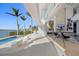 Bright patio with pool and view of the water at 3638 San Remo Ter, Sarasota, FL 34239