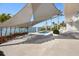 Luxury pool area with shade sail, patio furniture, and stunning water views at 3638 San Remo Ter, Sarasota, FL 34239