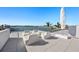 Spacious rooftop deck with modern furniture and water views at 3638 San Remo Ter, Sarasota, FL 34239