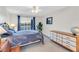 Cozy bedroom with a double bed, dresser, and balcony access at 3751 Lake Bayshore Dr # H304, Bradenton, FL 34205