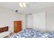 Bedroom with double bed, dresser, and double door closet at 3751 Lake Bayshore Dr # H304, Bradenton, FL 34205