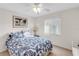 Bedroom with double bed, ceiling fan, and window with blinds at 3751 Lake Bayshore Dr # H304, Bradenton, FL 34205