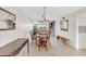 Bright dining area with a rustic wooden table and bench at 3751 Lake Bayshore Dr # H304, Bradenton, FL 34205