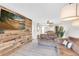 Spacious living room with comfortable seating and a feature wall at 3751 Lake Bayshore Dr # H304, Bradenton, FL 34205