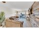Spacious living room with comfortable seating and a stunning wood accent wall at 3751 Lake Bayshore Dr # H304, Bradenton, FL 34205