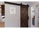 Rustic barn door adds character to the home's interior at 38355 State Road 64 E, Myakka City, FL 34251